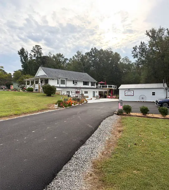 Ranch style home surrounded by forestry.