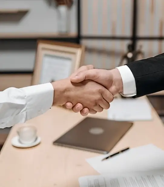 Two hands shaking in agreement.